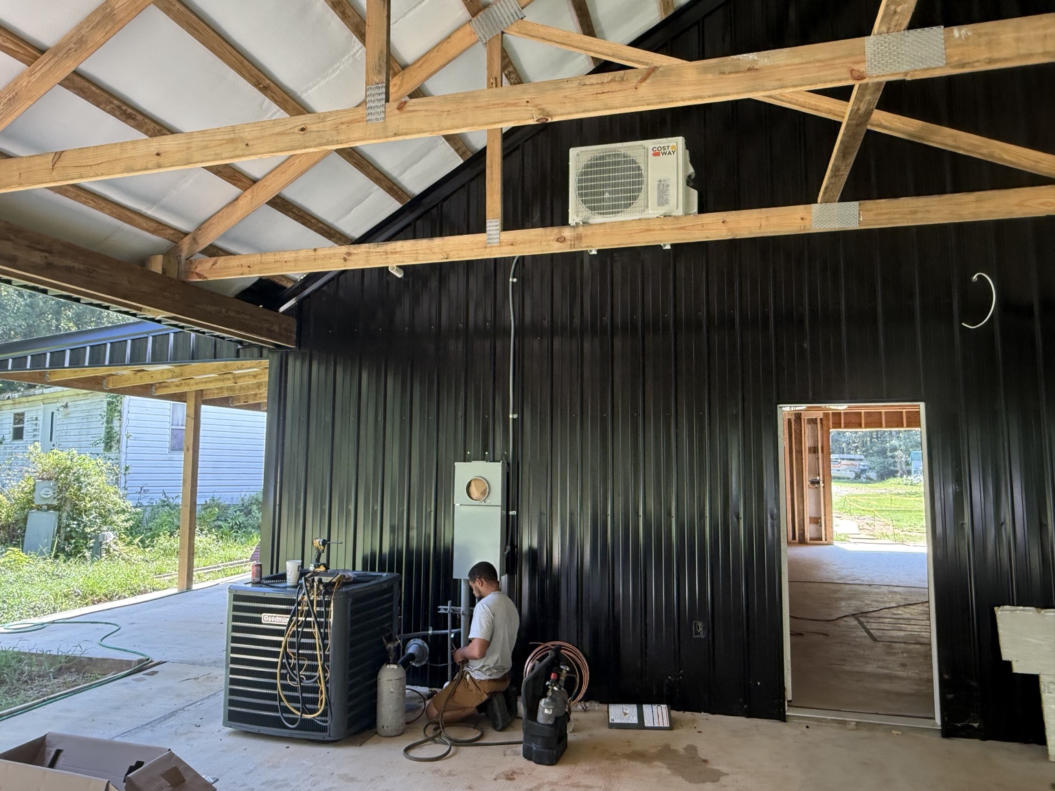 Morgan Repair HVAC technician installing a new system at a new construction site in Shreveport, LA